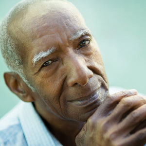 Elderly man smiling after Glaucoma treatment
