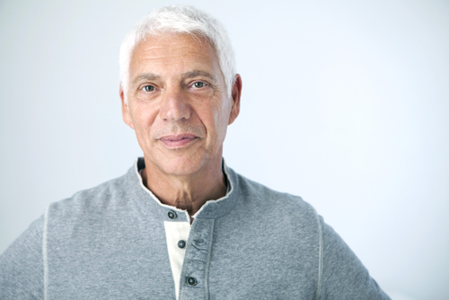 Senior man against a white background