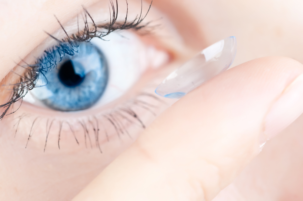 Woman using contact lenses