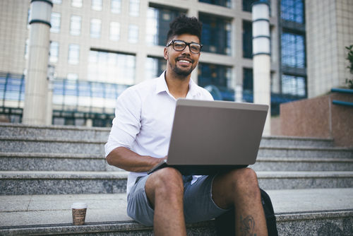 Young man with eyeglasses considering LASIK