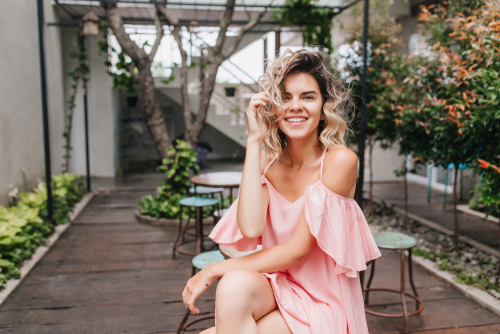 woman sitting at outdoor patio