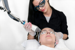woman receiving a laser resurfacing procedure